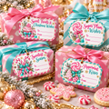 Pink nutcracker printable Christmas gift tags in pink, aqua and gold tied onto pink and aqua wrapped presents with peppermints