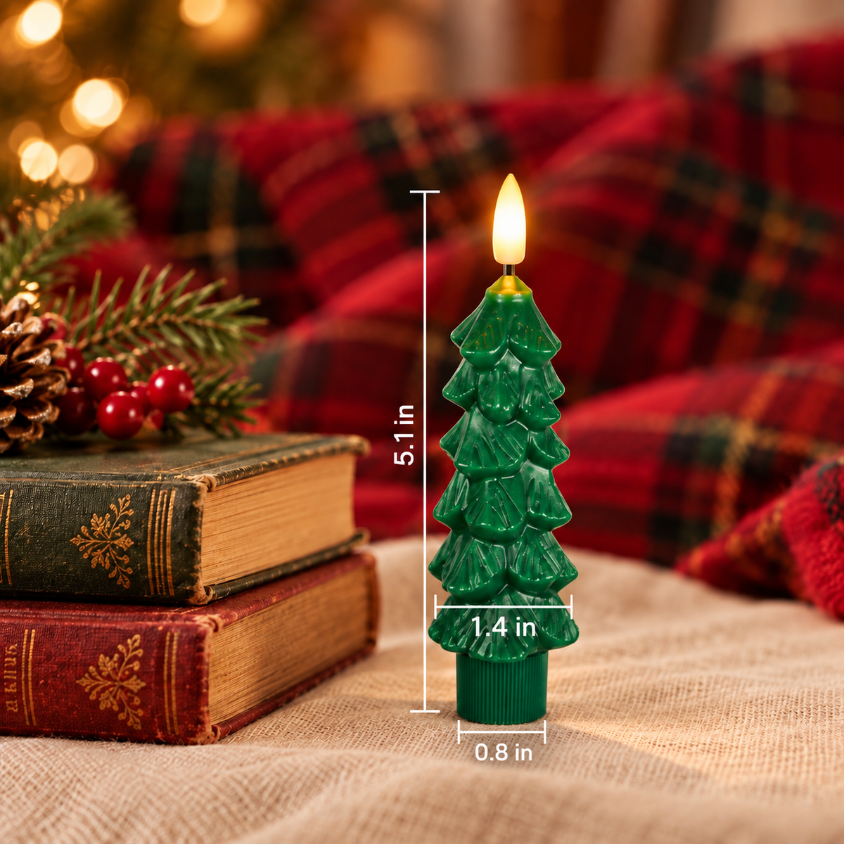 Small 5.1 inch green Christmas tree LED candle next to vintage books with size measurements