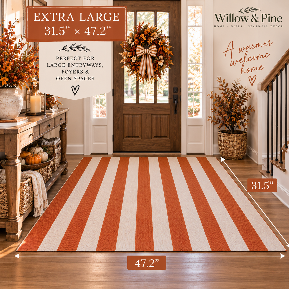 An extra large striped entryway rug shown in a decorated home foyer. The rug has alternating warm rust-orange and cream vertical stripes.