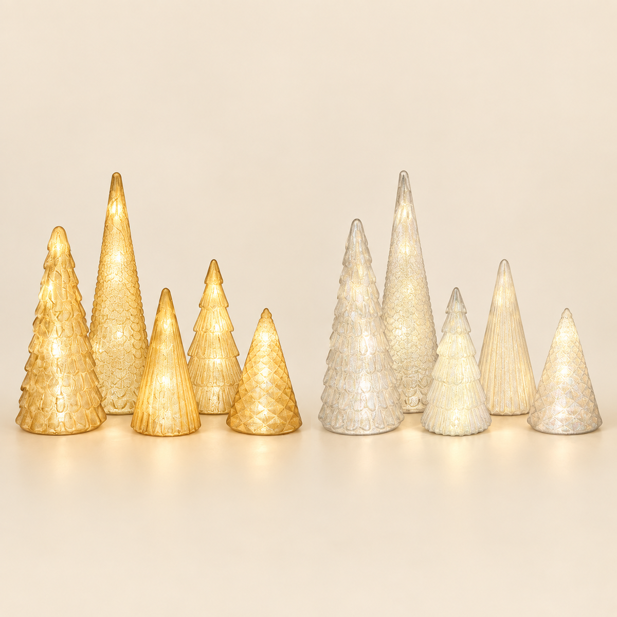 Gold and silver lighted tabletop tree sets side by side showing both color options
